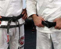 What does the rank bar on a BJJ belt mean?