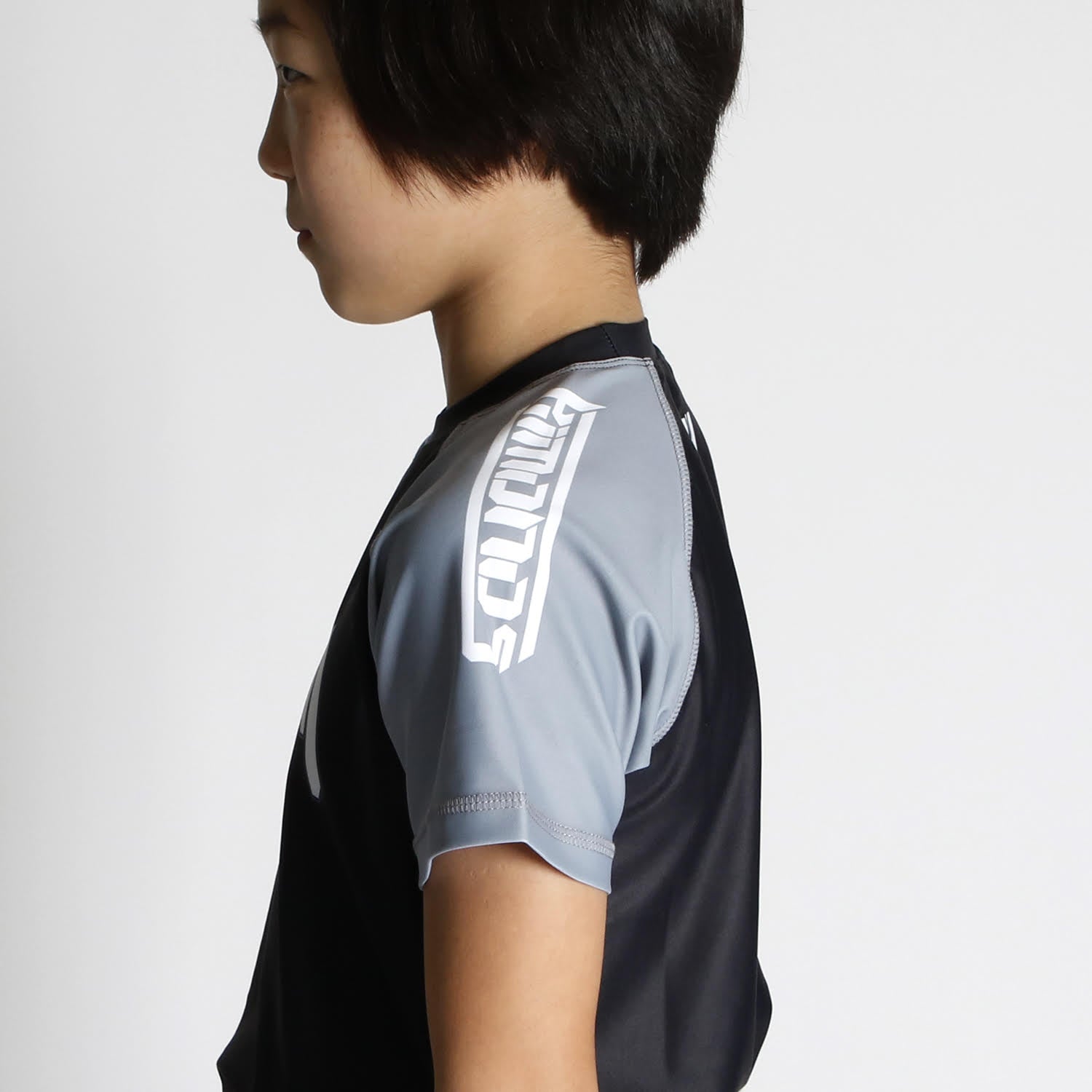 Isami Kids BJJ Rash Guard Grey on model, side profile