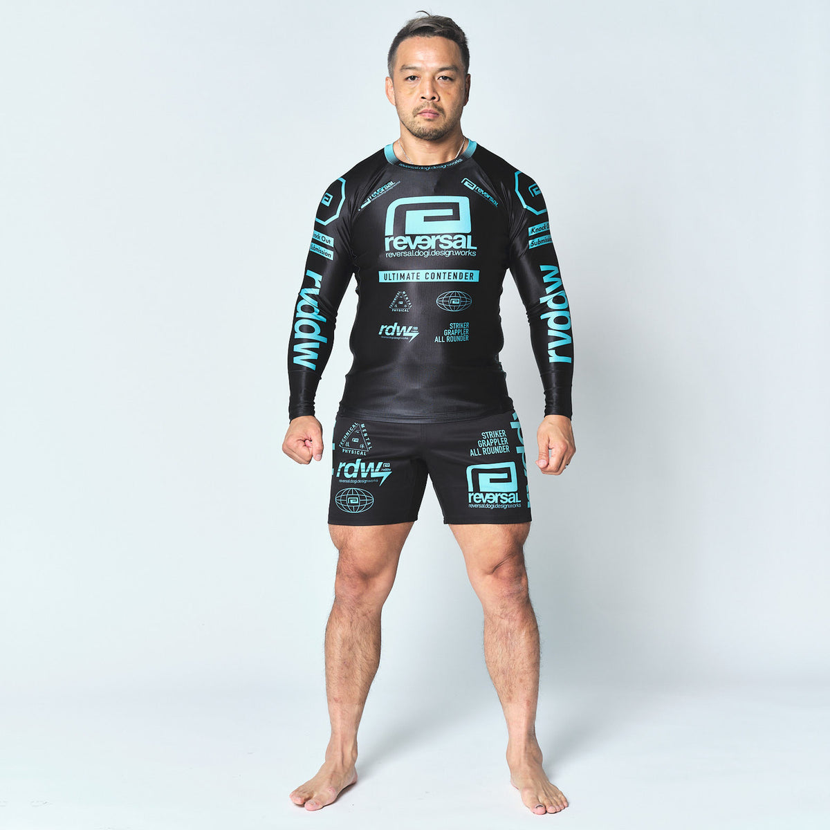 Reversal RVDDW Racing Rash Guard – Black-Turquoise – model shot
